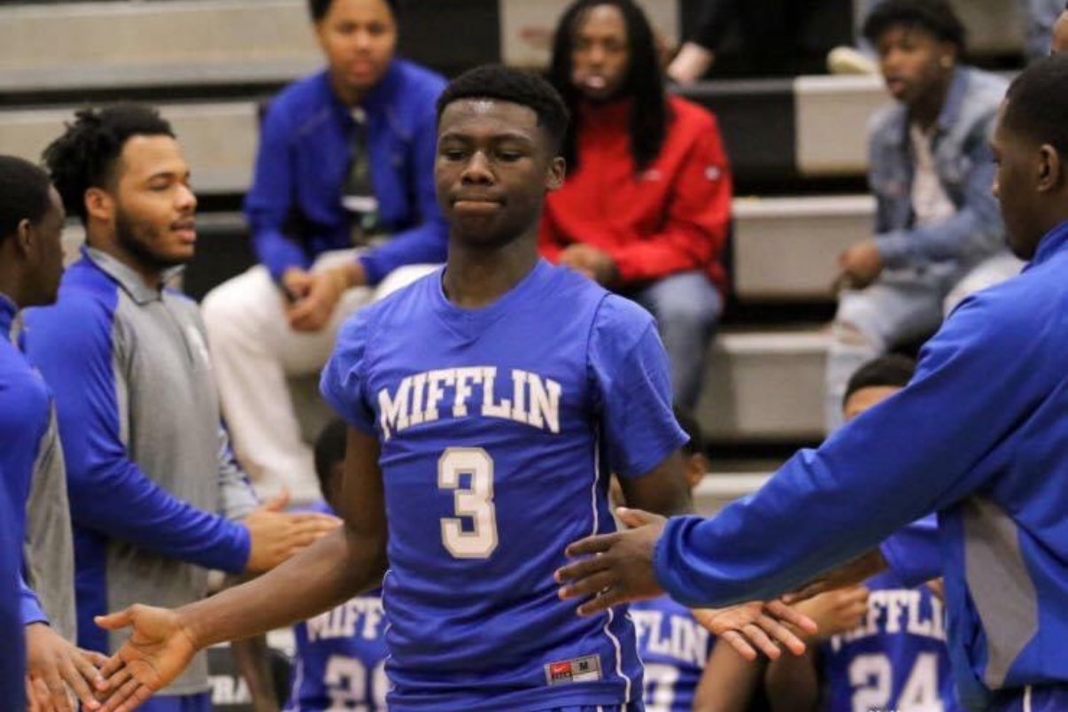 High school basketball players high-fiving teammates during introductions